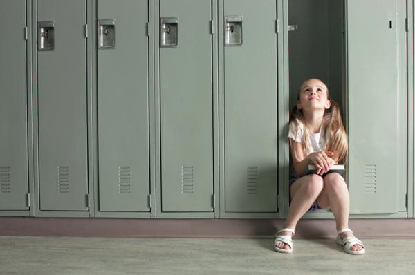Girl in front of lockers